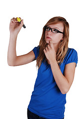 Image showing Girl writing on glass wall.