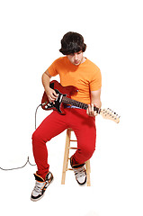 Image showing Teen boy with guitar.