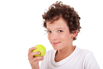 Image showing boy eating a green apple