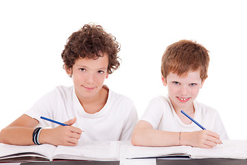 Image showing Two students with a pencil, writing