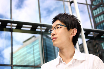 Image showing asian young, handsome business man at the office building 