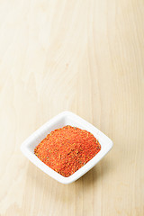 Image showing Red spice mixture on wood