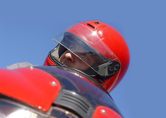 Image showing Man on a red bike