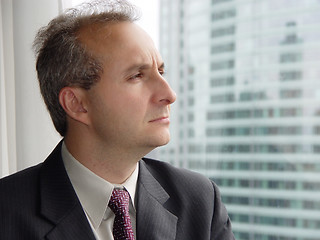 Image showing Businessman in his office by the window