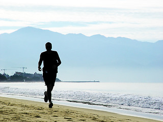 Image showing Man running on the beach