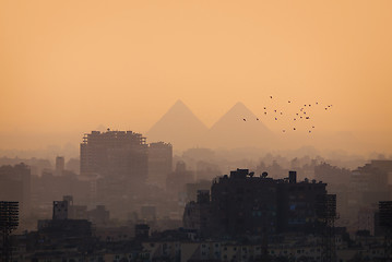 Image showing Cairo city skyline and Pyramids