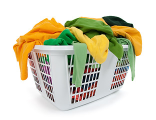 Image showing Bright clothes in laundry basket. Green, yellow.