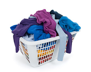 Image showing Bright clothes in laundry basket. Blue, indigo, purple.