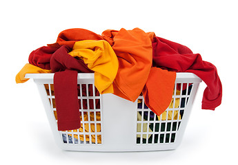 Image showing Colorful clothes in laundry basket. Red, orange, yellow.