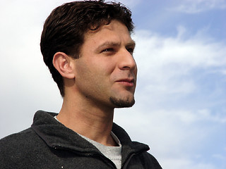 Image showing Young man against the blue sky