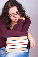 Image showing woman with stack of books