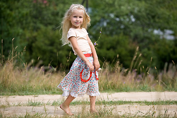 Image showing girl with summer flowers