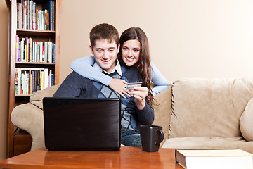 Image showing Happy couple shopping online