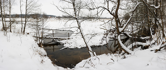 Image showing Winter landscape with stream and bridge, panorama from 5 images