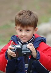 Image showing Boy with a camera.