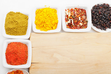 Image showing Spices at wooden board above view