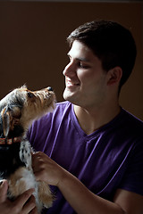 Image showing Man Holding His Dog