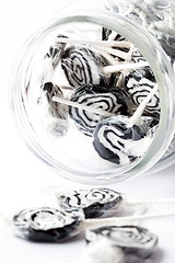 Image showing Black lollipops on white