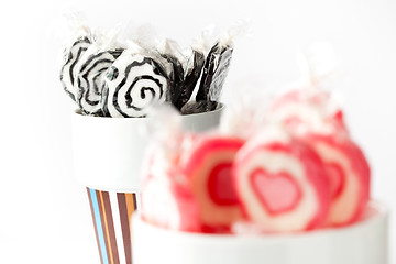 Image showing Blak and pink lollipops