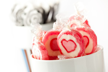 Image showing Pink and black lollipops