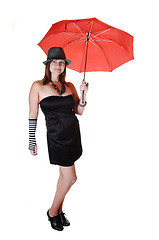 Image showing Lady with hat and umbrella.