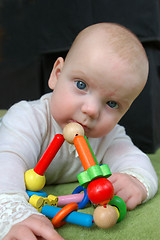 Image showing Toddler with rattle