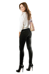 Image showing Smiling girl in black tight jeans