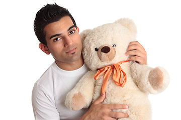 Image showing Affectionate man holding bear