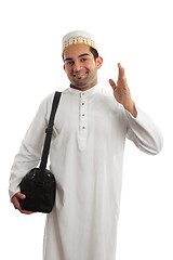 Image showing Friendly ethnic man waving