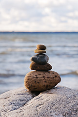 Image showing Pyramid of the small pebbles on the beach 