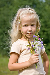 Image showing blonde girl with wild flowers