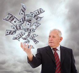 Image showing Businessman holding something