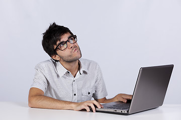 Image showing Young man working with his laptop