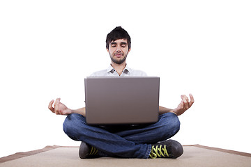 Image showing Young man meditating with his laptop