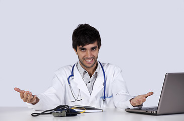 Image showing frendly young doctor at his office