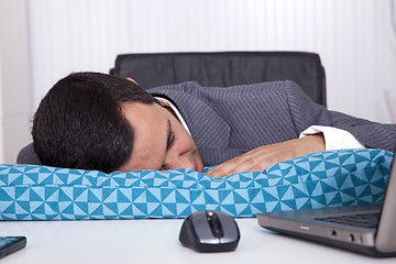 Image showing Businessman sleeping at the office