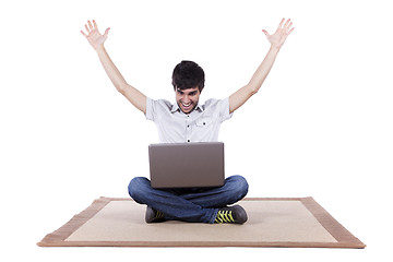 Image showing Happy young man surfing the internet