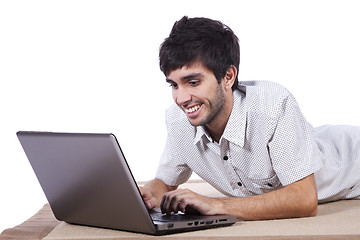 Image showing Happy young man surfing the internet