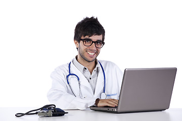 Image showing frendly young doctor working with his laptop