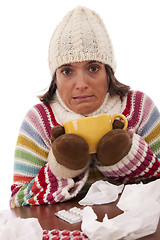 Image showing woman with flu symptoms drinking a hot drink