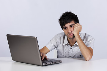 Image showing Young working with his laptop