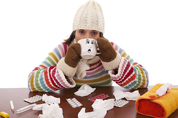 Image showing woman with flu symptoms drinking a hot drink