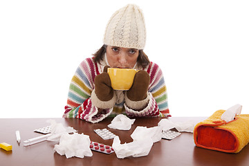 Image showing woman with flu symptoms drinking a hot drink
