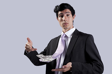 Image showing Businessman with a flying necktie with money