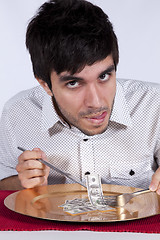 Image showing Man eating little dollar banknote