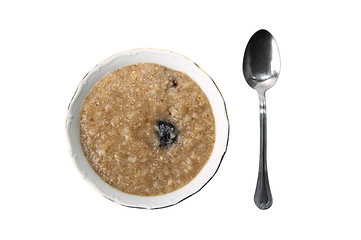 Image showing spoon and a plate with a porridge
