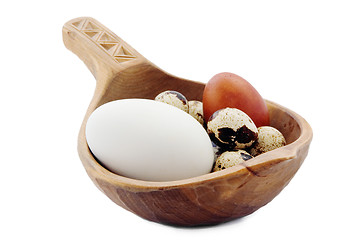 Image showing Eggs in a wooden ladle