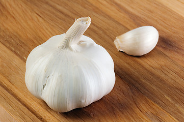 Image showing garlic on a wooden kitchen board