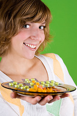 Image showing woman with heap of pills