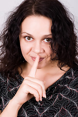 Image showing woman with finger on lips